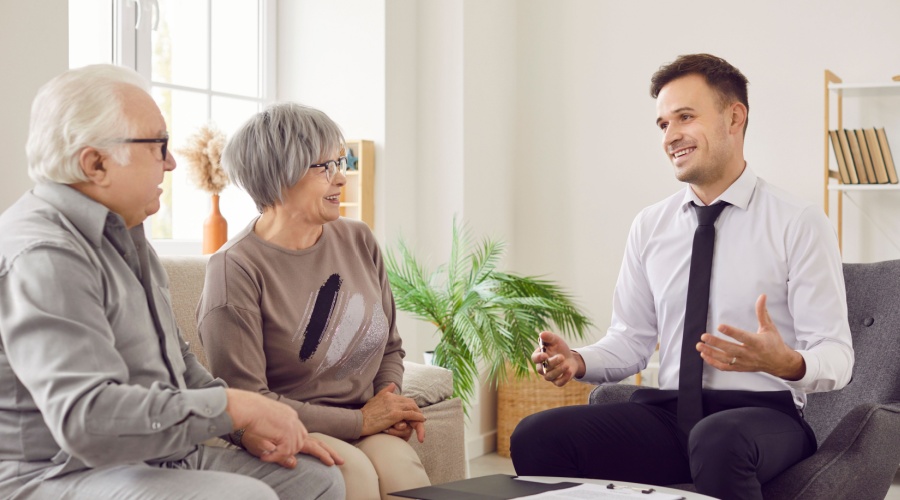 Elder couple talking to advisor