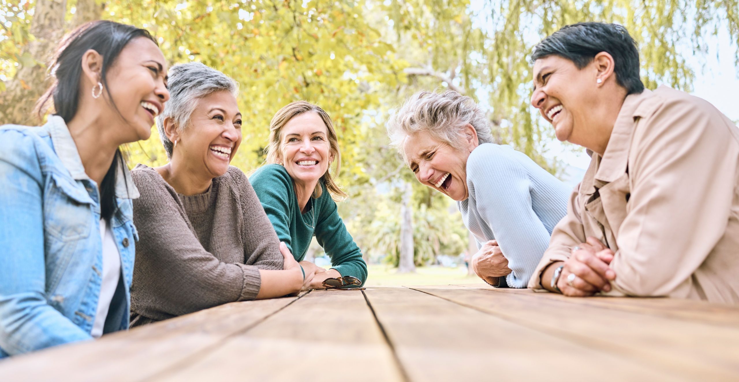 Elder people laughing at a table