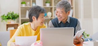 elderly-asian-couple-reviewing-their-retirement-income